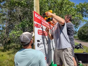 Installing the boat decontamination station at the Horseshoe Lake public landing, 2021